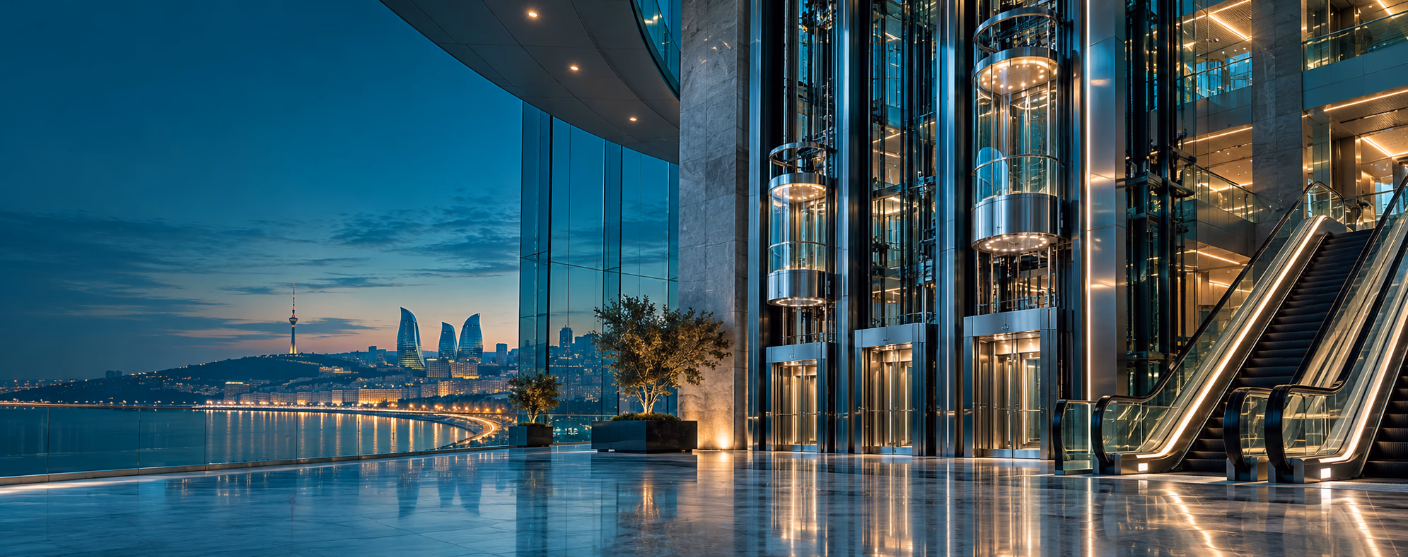 Modern glass elevators and escalators overlooking the Baku skyline